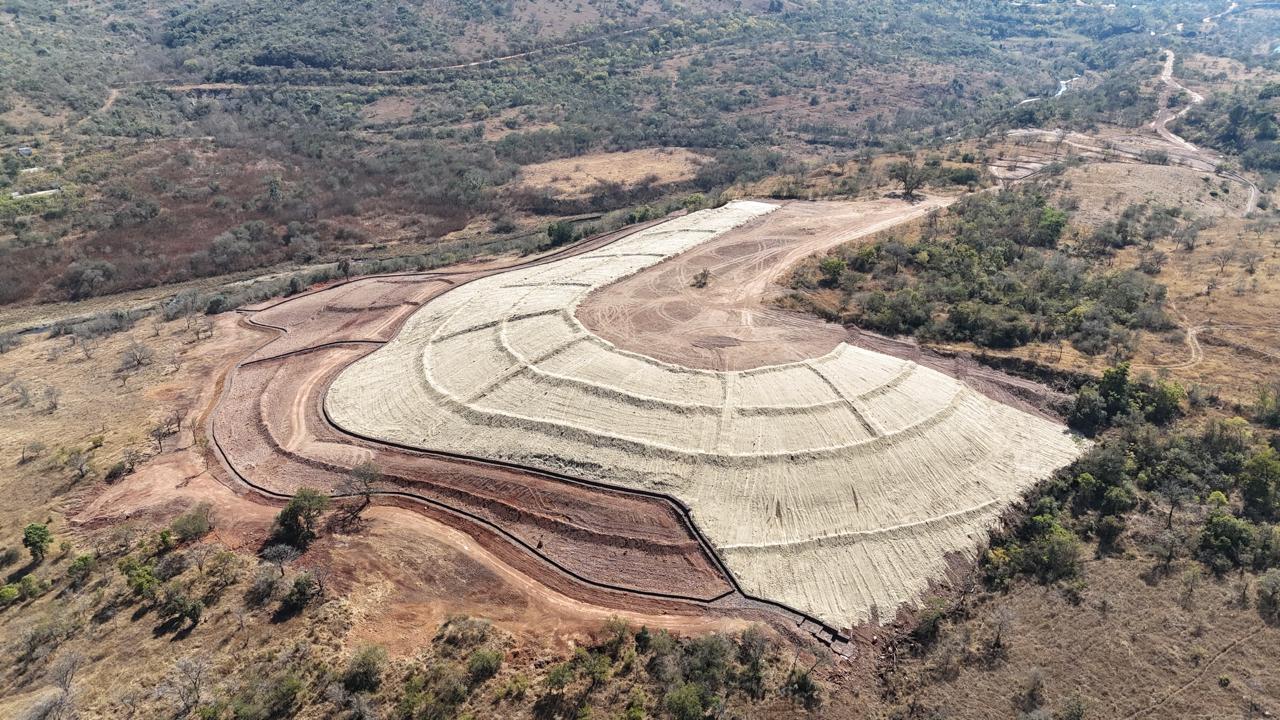 Terraced slope covered with erosion blanket and edged with a gabion wall at Badplaas