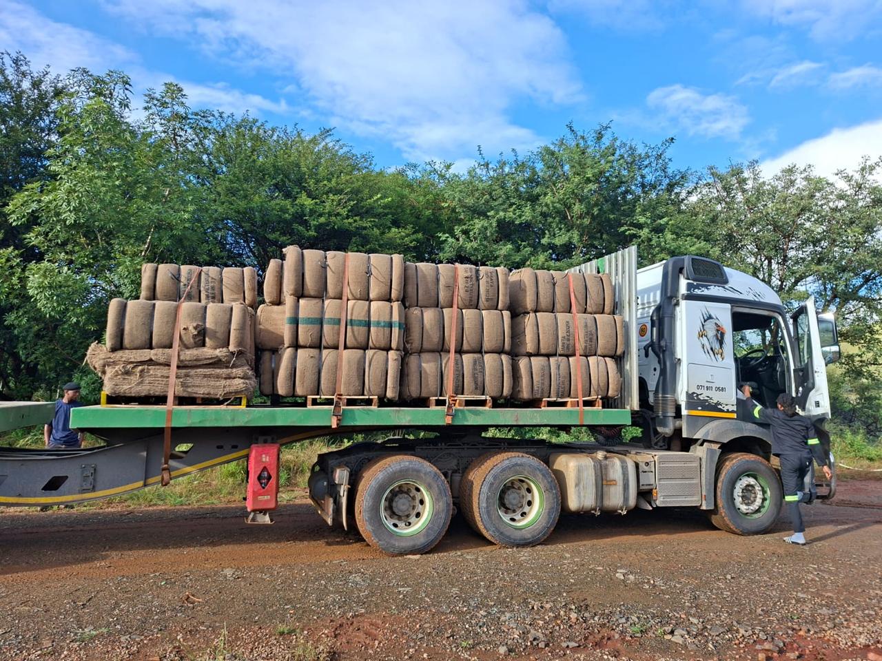 Truck loaded with bales of BioJute and erosion blanket for the Elukwatini project