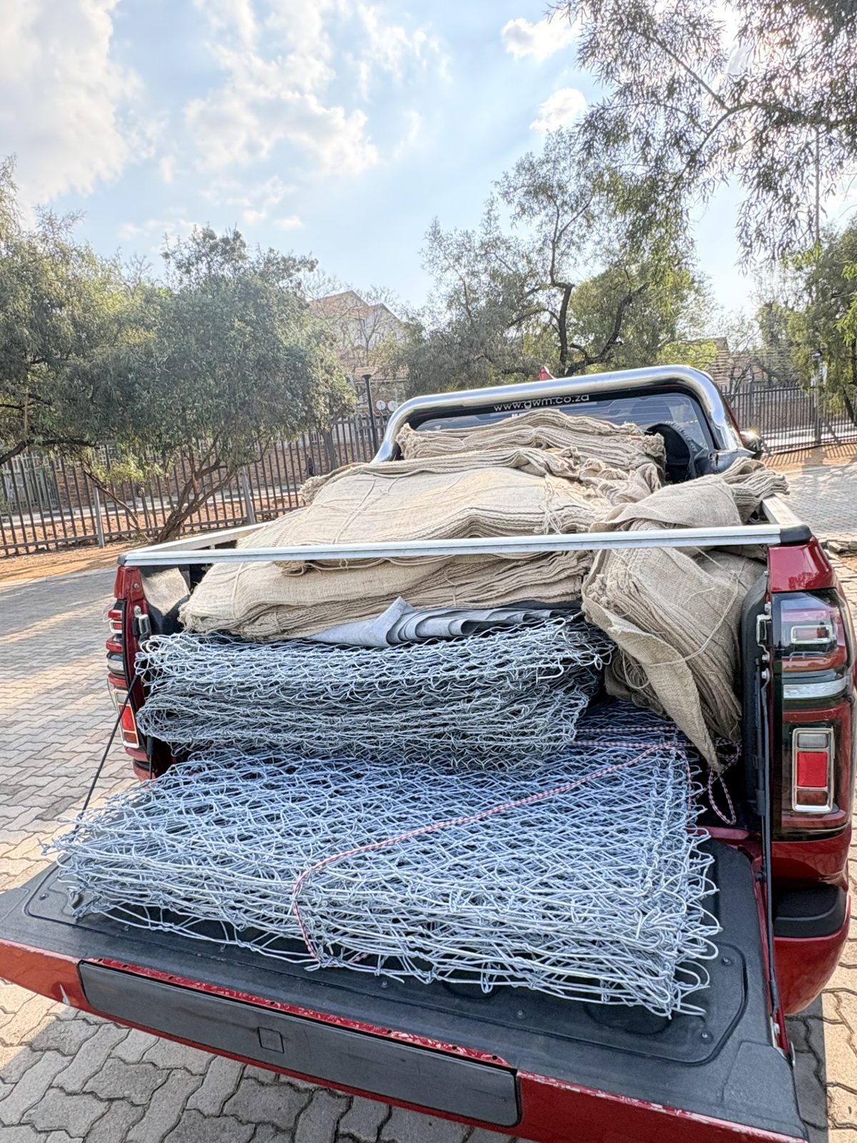 Bakkie loaded with hessian bags and gabion mesh for the Balfour project